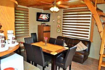 Фото номера Дом с 2 спальнями Дома для отпуска Ievnieki Guest House г. Cenkone 30